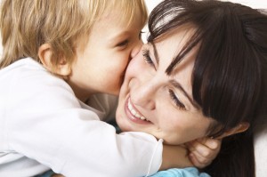 little boy hugging her mother