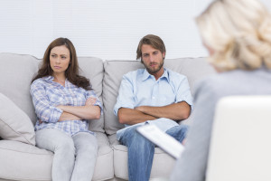 Young couple going through therapy and listening to the therapist