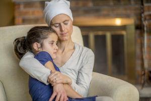 Little Girl Sitting in Her Mother's Lap